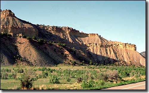 Red sandstone cliffs along the side of Indian Canyon Scenic Byway